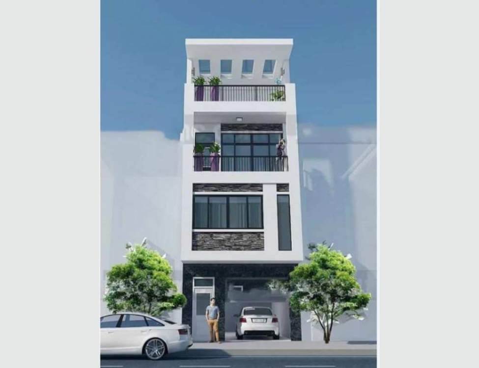 Nhà phố hiện đại 4 tầng với gara ô tô, cây xanh trước cửa. Người đàn ông đứng dưới, trời xanh trong.