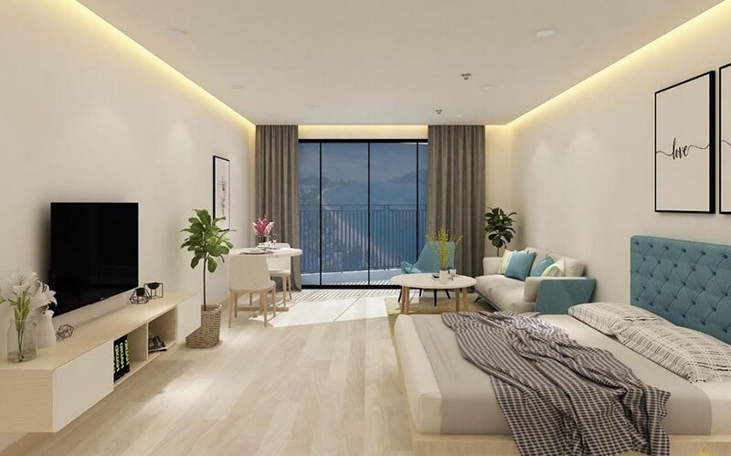 Căn hộ hiện đại với giường ngủ, sofa và ban công nhìn ra cảnh núi non. Đèn LED trang trí tạo không gian ấm cúng.