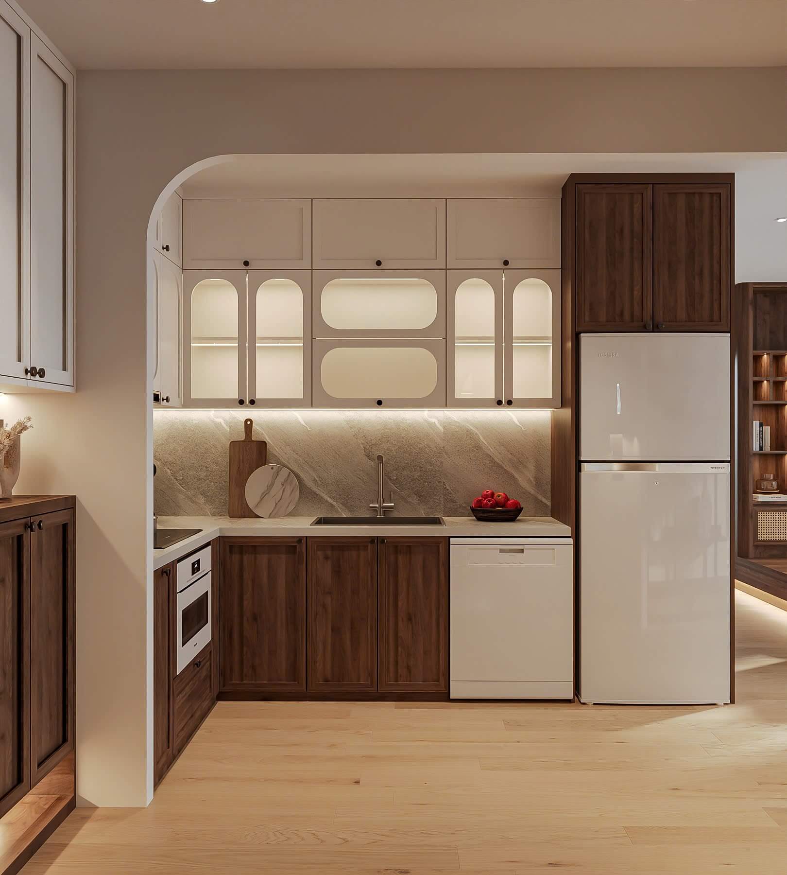 Nhà bếp hiện đại với tủ gỗ tối màu, tủ lạnh trắng, mặt bàn đá và ánh sáng mềm mại.