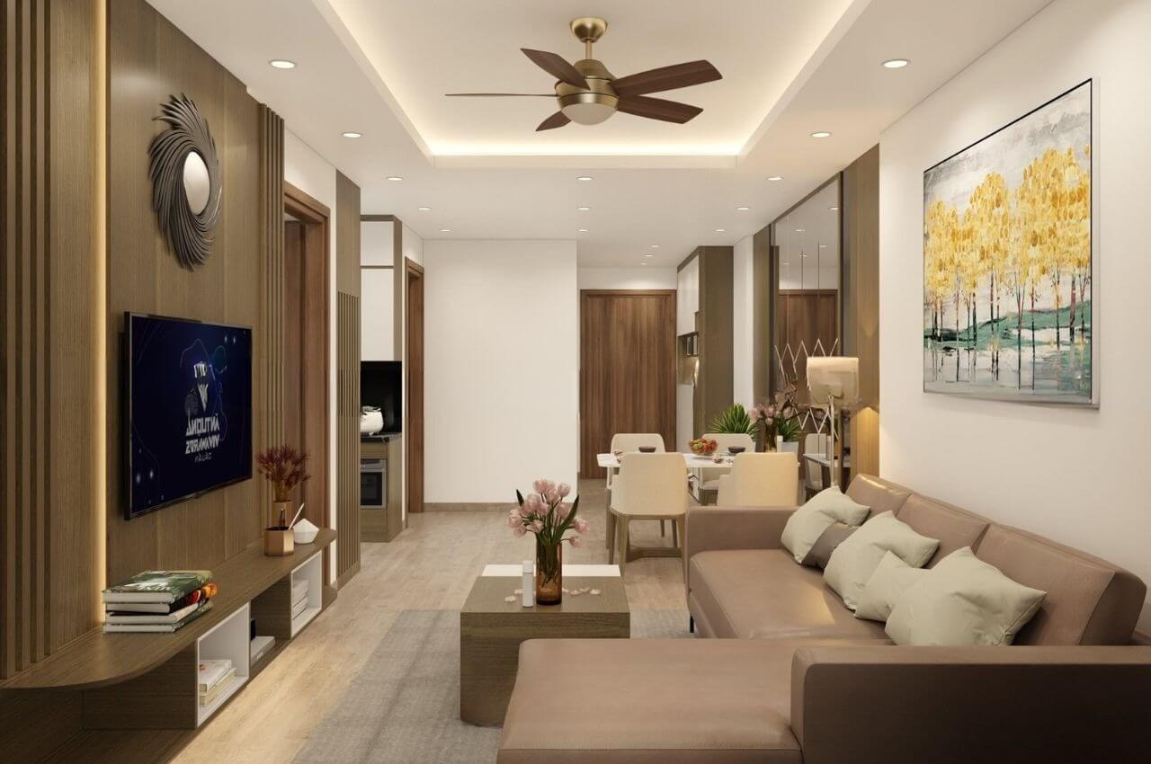 Phòng khách hiện đại với sofa nâu, tranh treo tường và quạt trần, nội thất tinh tế và ánh sáng trang nhã.