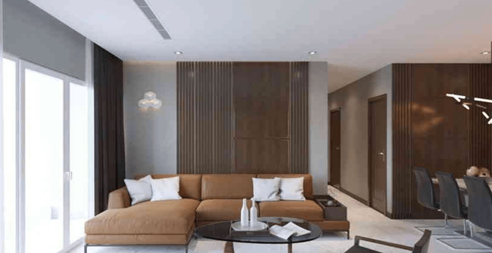 Phòng khách hiện đại với sofa nâu, bàn tròn và tường gỗ, cửa kính lớn mang lại ánh sáng tự nhiên.