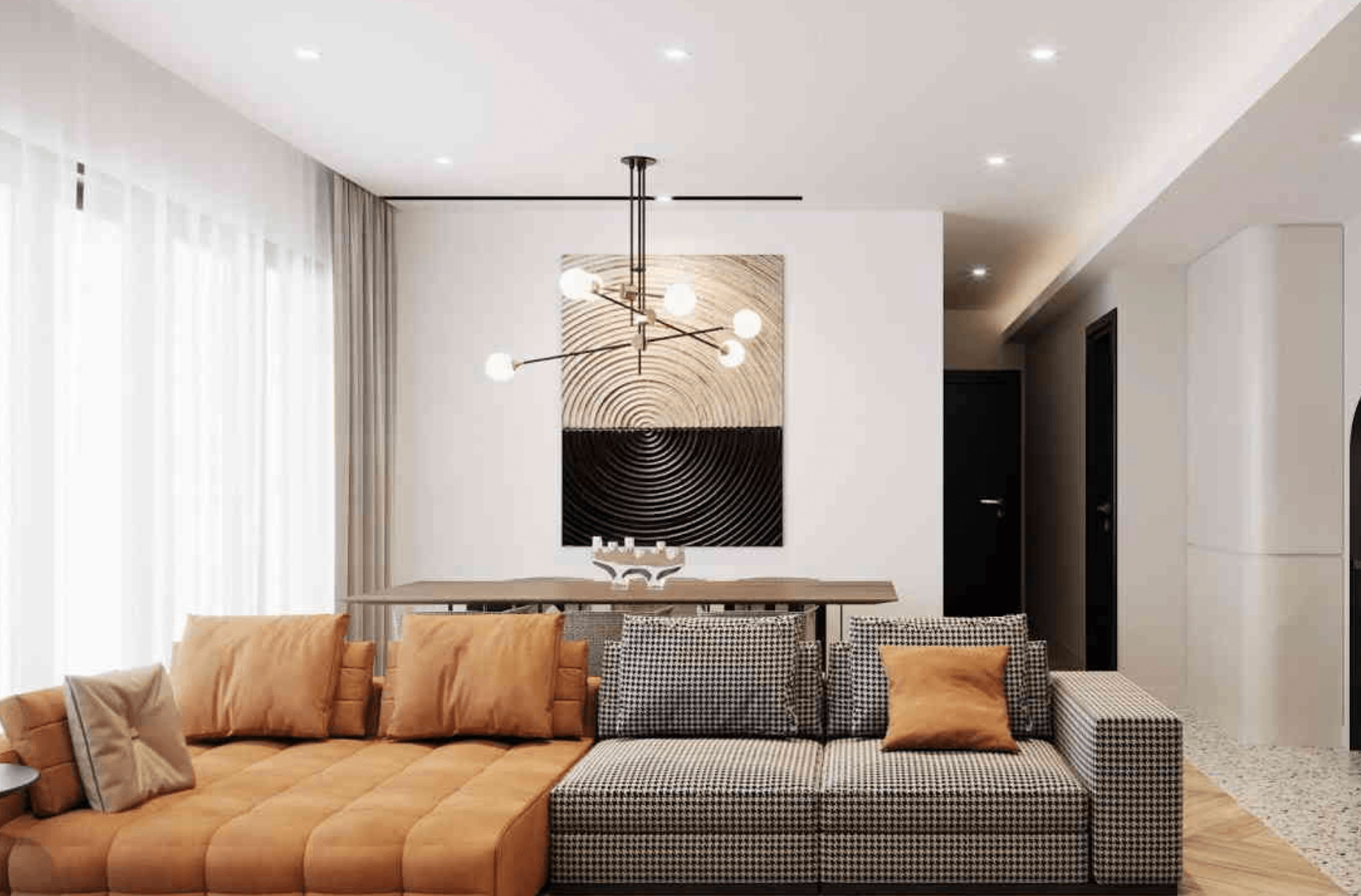 Phòng khách hiện đại với ghế sofa, đèn trần và tranh trang trí độc đáo, ánh sáng tự nhiên từ cửa sổ lớn.