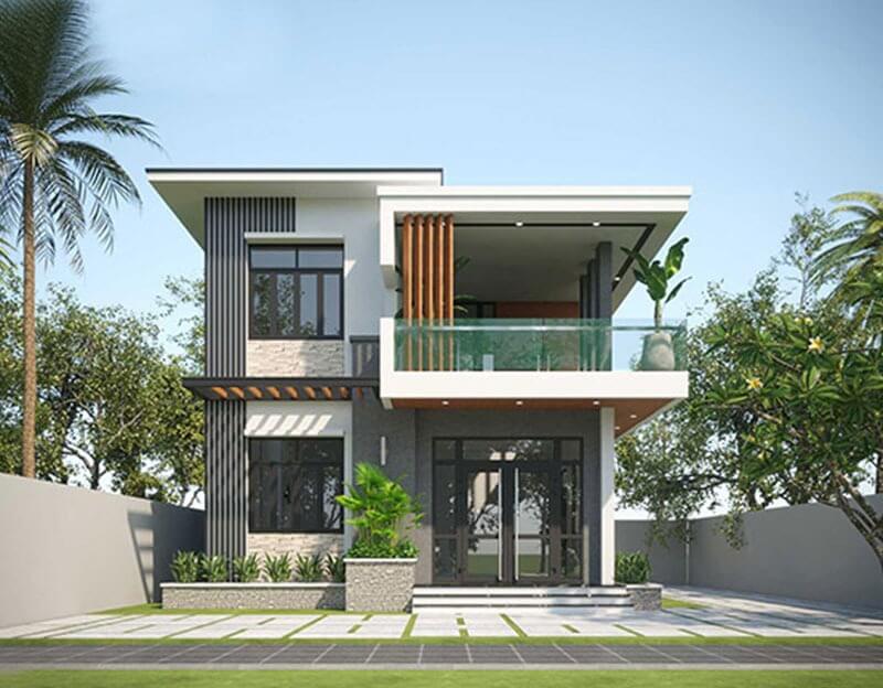 Mẫu nhà hiện đại hai tầng với cửa kính lớn và ban công xanh, cây cối bao quanh, tạo không gian sống thư giãn.