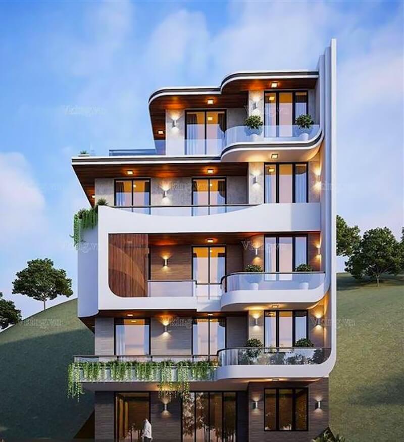 Tòa nhà hiện đại với thiết kế ban công độc đáo và ánh sáng lung linh vào buổi tối.