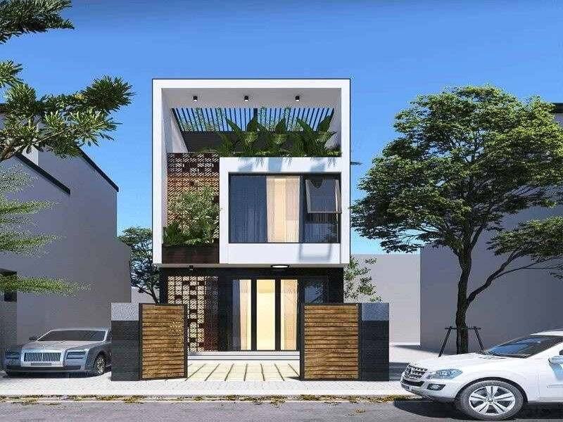 Mặt tiền nhà phố hiện đại với thiết kế xanh và cửa sổ lớn, cây xanh xung quanh, hai ô tô đỗ trước nhà.
