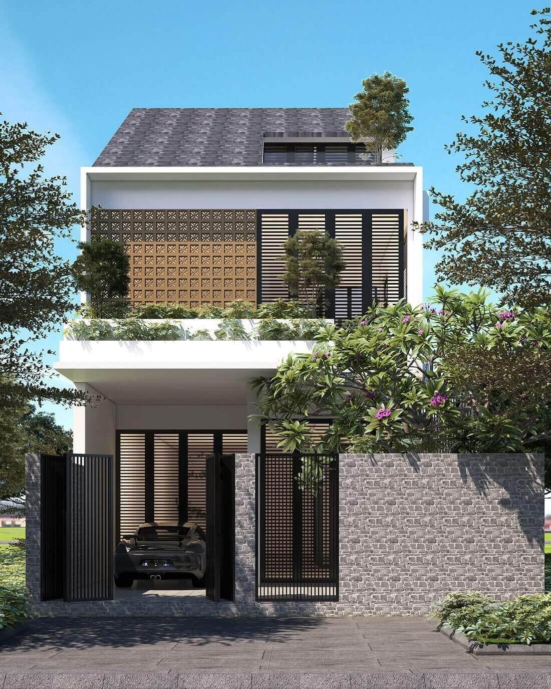 Nhà hiện đại ba tầng với thiết kế cây xanh, cửa sổ lớn và cổng đá tự nhiên, bầu trời xanh trong.