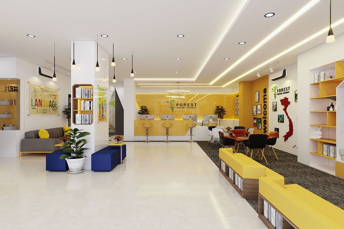 Phòng học hiện đại với thiết kế nội thất trẻ trung, tông màu vàng chủ đạo, bảng chào mừng và bản đồ Việt Nam.