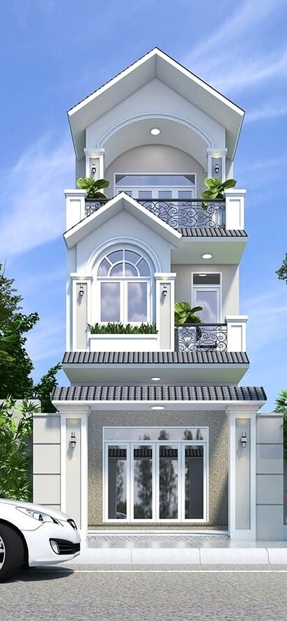 Nhà phố 3 tầng hiện đại với ban công cây xanh và xe ô tô đậu trước nhà, bầu trời xanh vài đám mây.