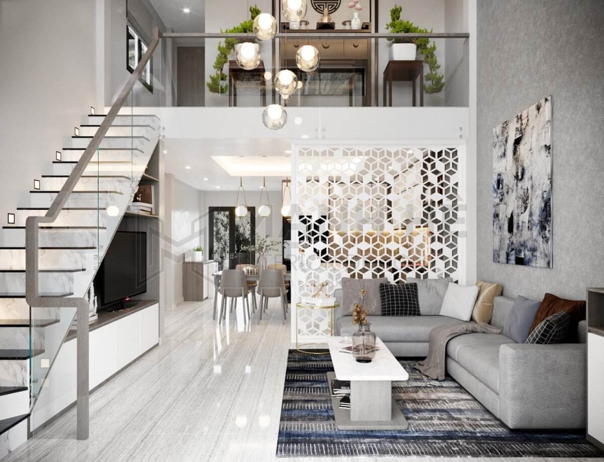 Phòng khách hiện đại với sofa xám lớn, tường trang trí và đèn treo phong cách.