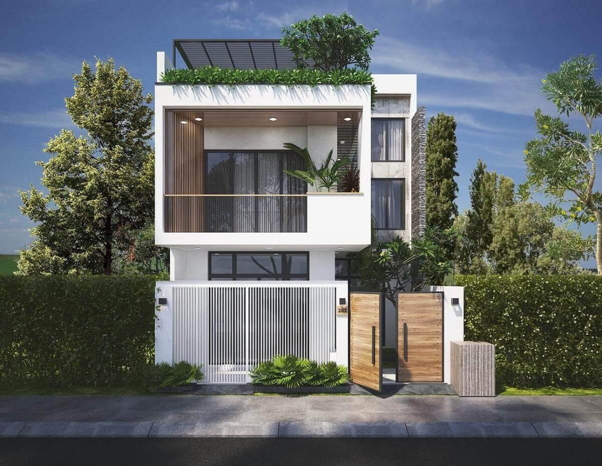 Nhà hiện đại 2 tầng với sân trước xanh mát, thiết kế cửa kính và cây cảnh trang trí.