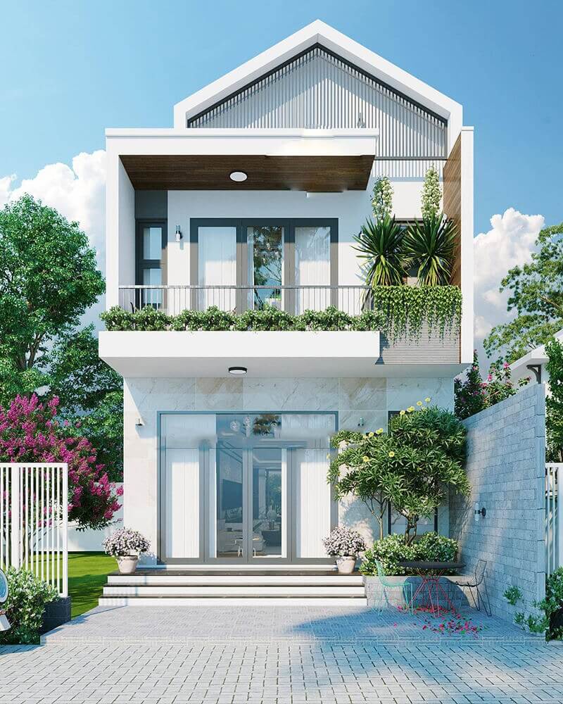 Nhà hai tầng hiện đại với ban công xanh tươi và thiết kế tối giản, trời xanh và cây cối bao quanh.