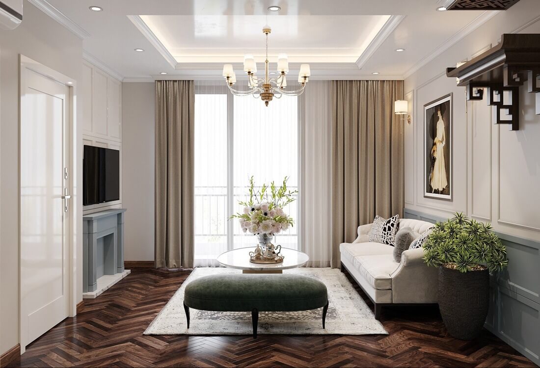 Phòng khách sang trọng với sofa trắng, đèn chùm, tranh treo tường, và cửa sổ lớn.