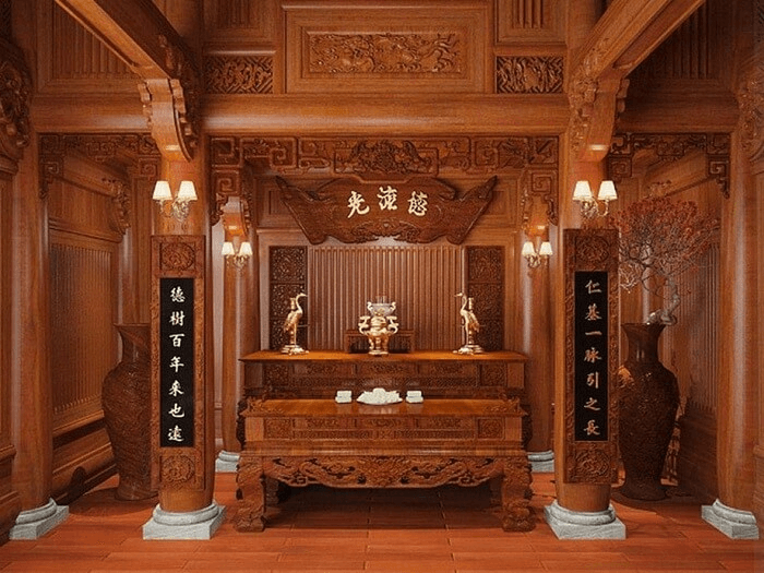 Bàn thờ truyền thống bằng gỗ, trang trí tinh xảo với đèn và câu đối, phong cách Việt trang nghiêm.