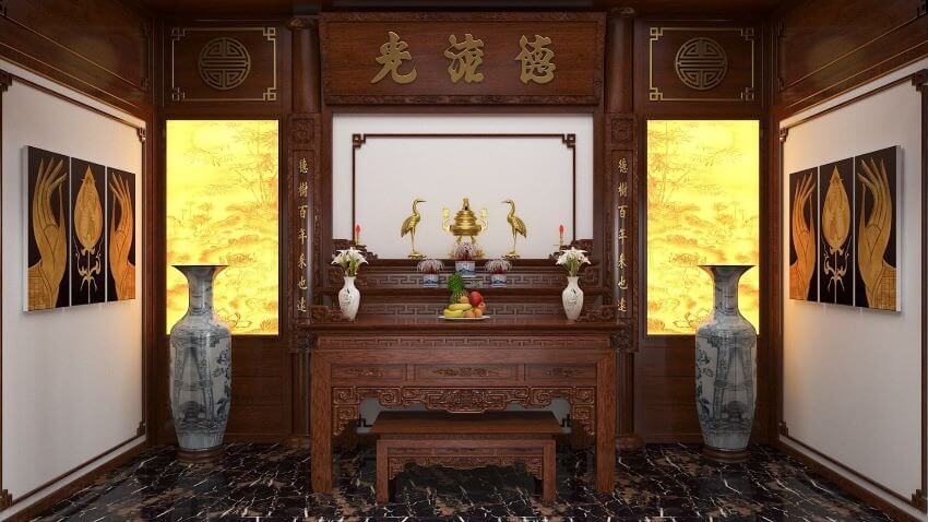 Bàn thờ gỗ trang nghiêm với lư đồng, hoa quả, kết hợp đèn vàng ấm áp và tranh treo tường, hai bình gốm lớn.