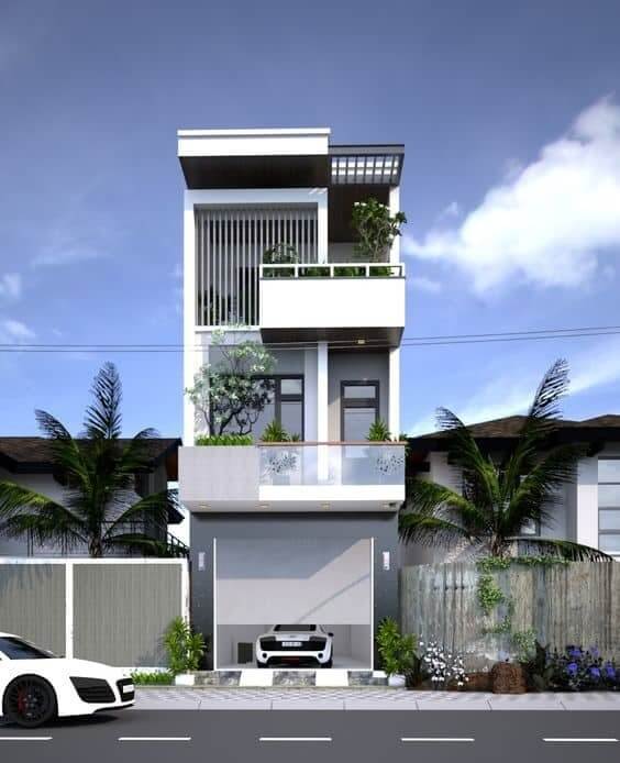 Nhà phố hiện đại 3 tầng với ban công xanh mát và ô tô đỗ trước gara.