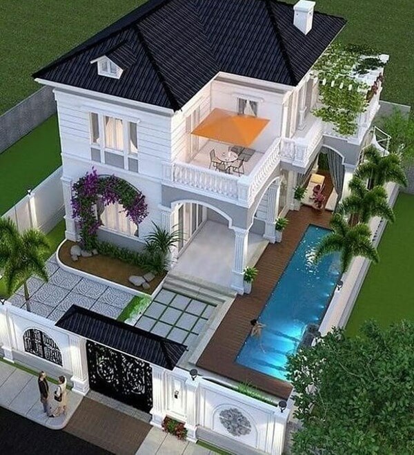 Biệt thự hiện đại có hồ bơi và vườn, phong cách sang trọng, ánh sáng ban đêm lung linh.