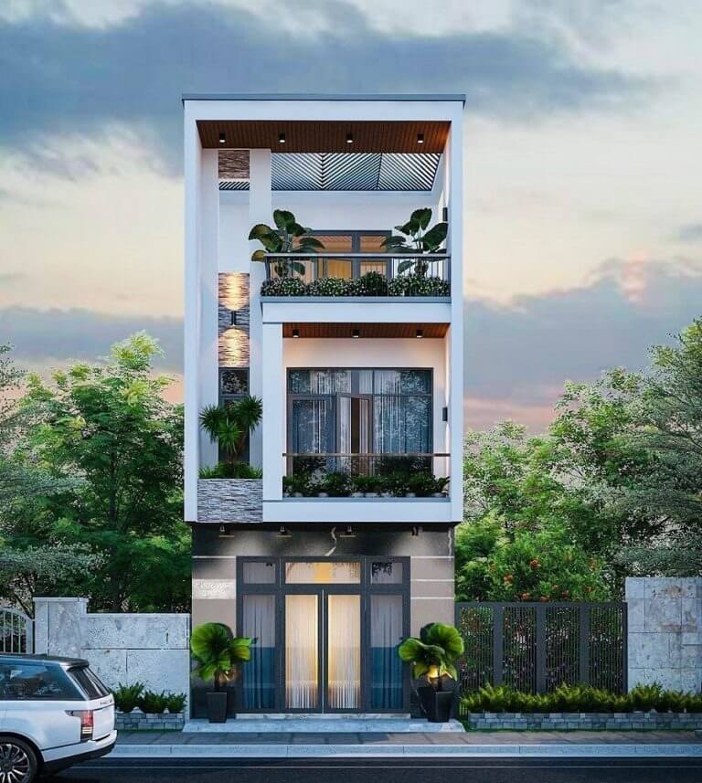 Nhà phố hiện đại hai tầng với ban công rộng, cây xanh, ô tô đậu phía trước. Kiến trúc thiết kế sang trọng, tinh tế.
