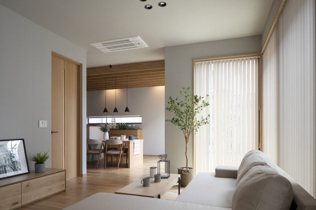 Phòng khách tối giản với ghế sofa, cây xanh, cửa sổ lớn và bàn ăn bằng gỗ phong cách hiện đại.