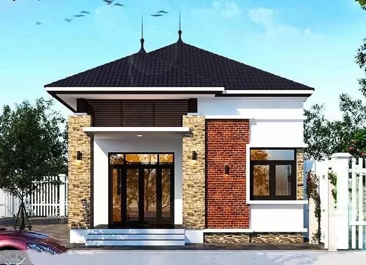 Nhà cấp 4 mái thái hiện đại, ngoại thất gạch đá, cửa kính lớn, sân rộng, cảnh quan thoáng đãng.