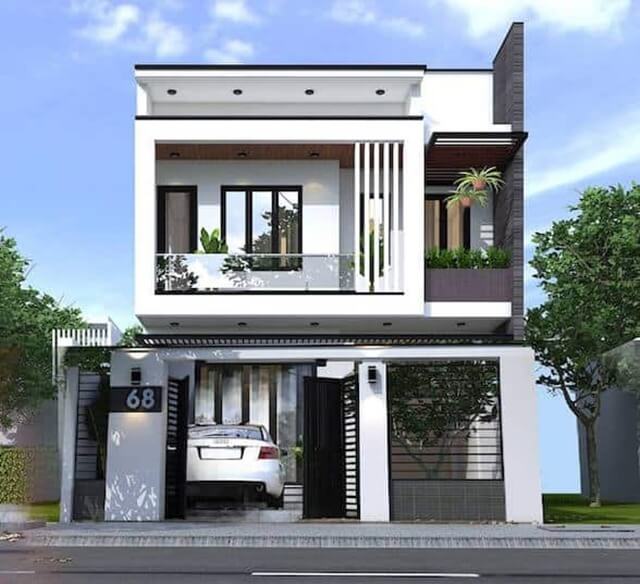 Nhà phố hiện đại hai tầng với gara ô tô, ban công kính và cây xanh trang trí, mặt tiền số 68.