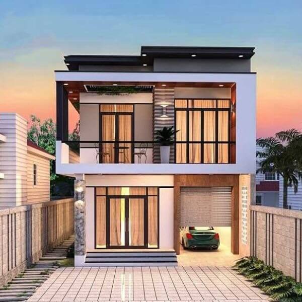 Nhà phố hai tầng hiện đại với ban công, cửa sổ lớn, và nhà để xe.