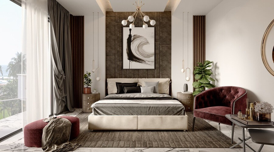 Phòng ngủ hiện đại với giường lớn, ghế sofa đỏ, tranh nghệ thuật, và cửa sổ lớn nhìn ra khung cảnh thiên nhiên.