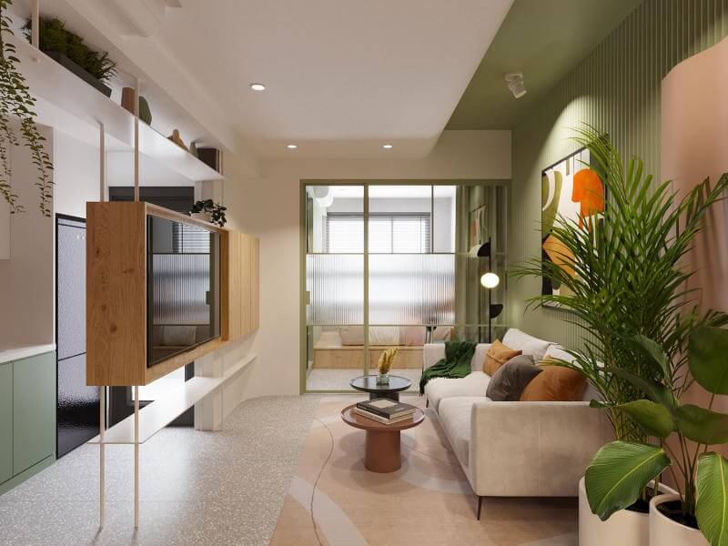 Phòng khách hiện đại với nội thất màu xanh lá, sofa trắng, bàn tròn và cây cảnh, ánh sáng tự nhiên.