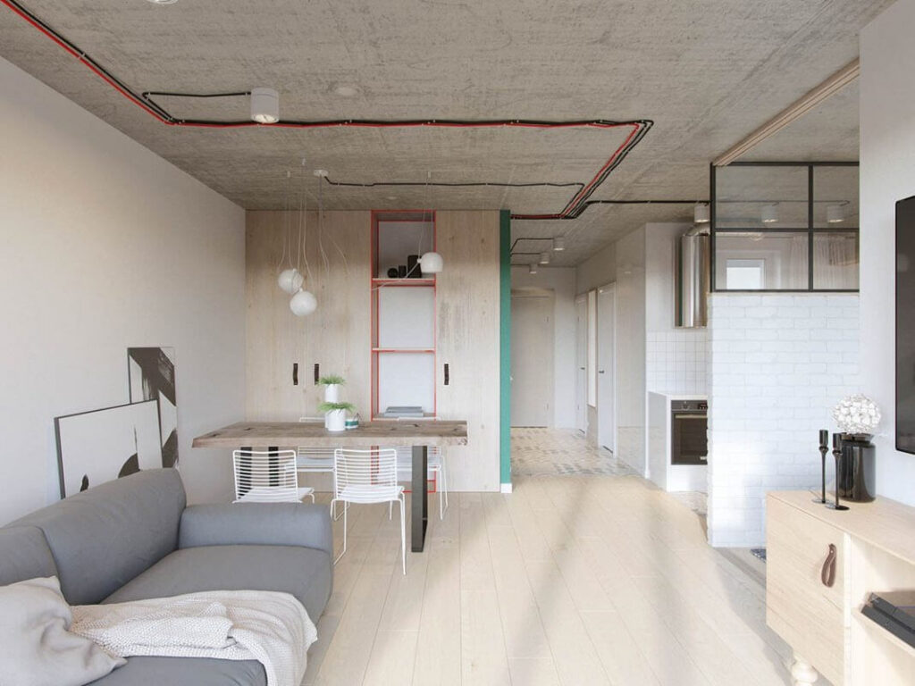 Phòng khách hiện đại với ghế sofa xám, bàn làm việc, và ánh sáng tự nhiên, thiết kế tối giản.