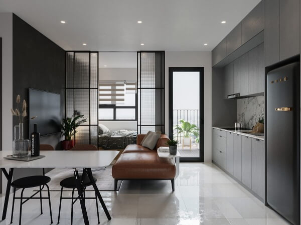 Căn bếp hiện đại với sofa da nâu, bàn ăn nhỏ và cửa kính lớn, kết nối với phòng ngủ có cửa kính ngăn.