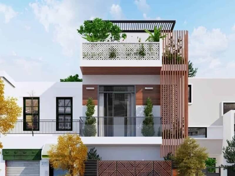Nhà hiện đại với mặt tiền đẹp, ban công cây xanh, thiết kế hợp thời, nền trời xanh.