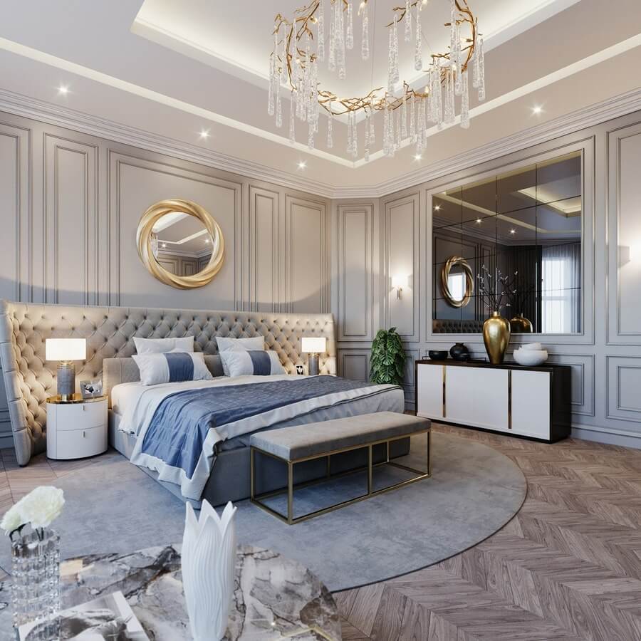 Phòng ngủ sang trọng với giường cỡ lớn, đèn trần trang trí và tường bao quanh bằng gỗ đẹp mắt.