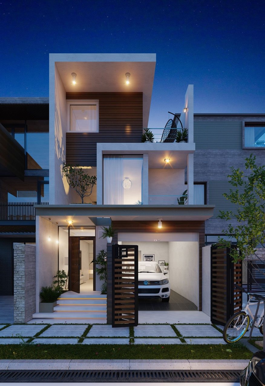 Ngôi nhà hiện đại 3 tầng vào ban đêm với gara xe và cửa kính lớn, ánh sáng ấm áp tỏa đều.
