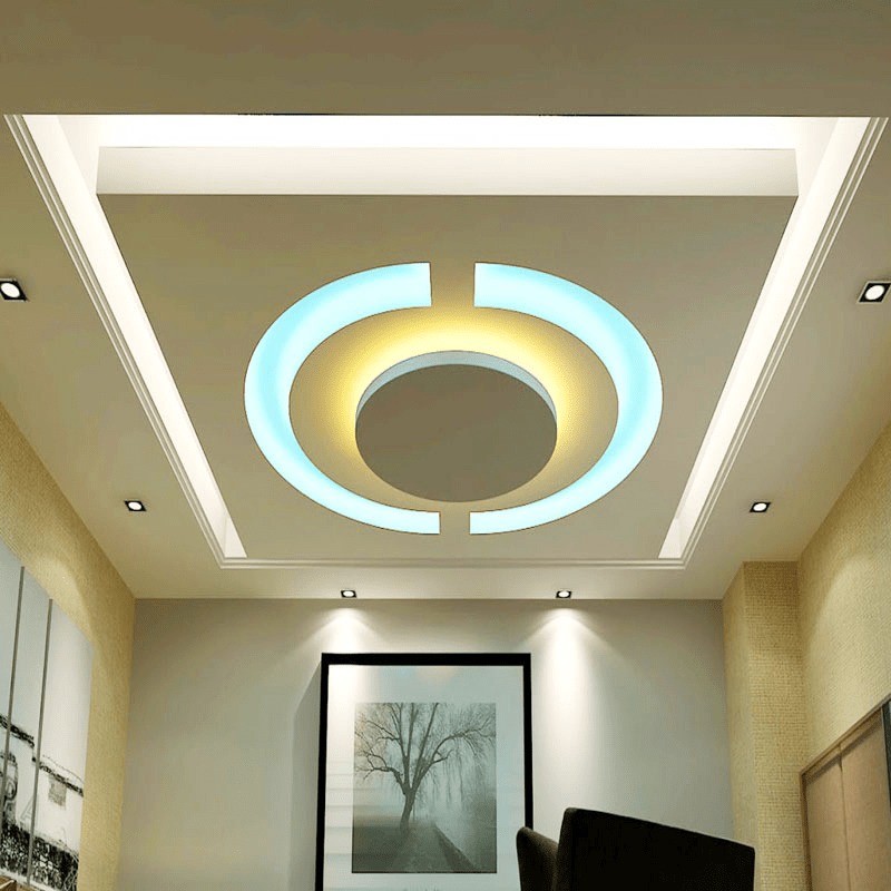 Trần thạch cao với thiết kế hiện đại, ánh sáng xanh và vàng, phòng khách sang trọng.