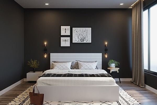 Phòng ngủ hiện đại với tường đen, giường trắng, ảnh treo tường nghệ thuật và đèn trang trí sáng tạo.