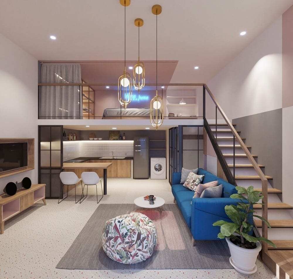 Căn hộ nhỏ gọn với sofa xanh, bếp hiện đại, nội thất gỗ sáng và gác xép tiện nghi.