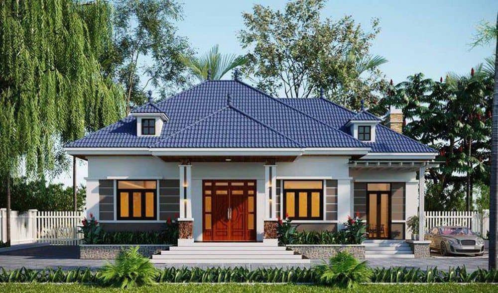 Nhà cấp 4 mái xanh hiện đại giữa vườn cây xanh, phong cách thoáng đãng và thân thiện với thiên nhiên.