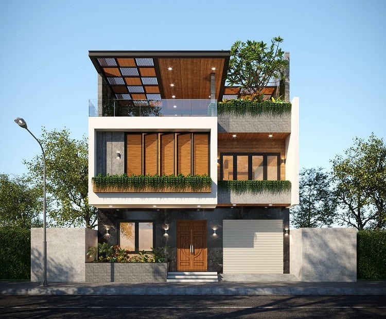 Nhà phố hiện đại ba tầng với thiết kế cây xanh và mặt kính trong suốt, ánh sáng tự nhiên chiếu từ bên ngoài.