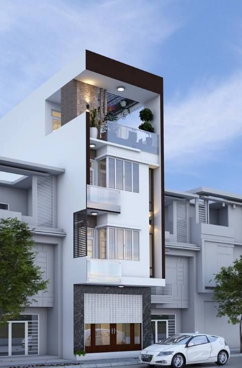Nhà phố hiện đại với bốn tầng, thiết kế tối giản, mặt tiền kính và cây xanh trên ban công.