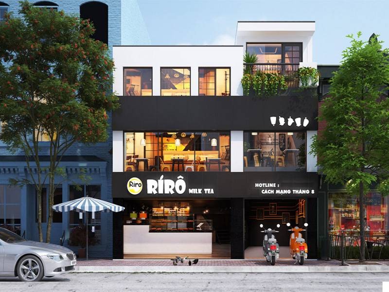 Cửa hàng trà sữa Rirô, mặt tiền hiện đại với bảng hiệu nổi bật, xe máy đỗ phía trước.