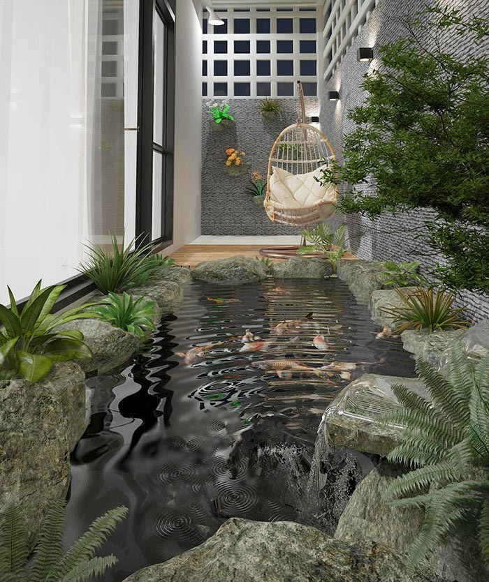 Hồ cá Koi nội thất với đá tự nhiên và cây xanh, không gian thư giãn với ghế treo và trang trí tường độc đáo.