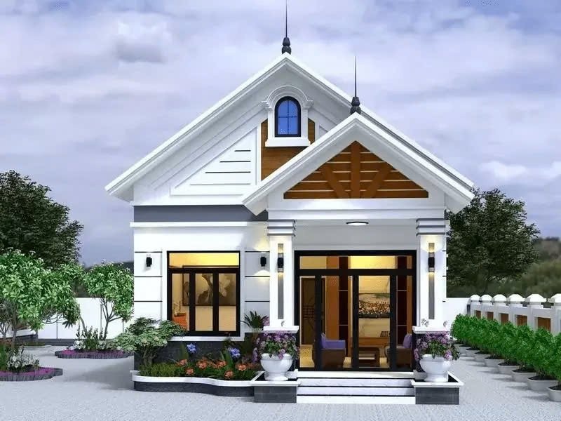Nhà cấp 4 mái thái màu trắng có sân vườn xanh, thiết kế hiện đại và thanh lịch.