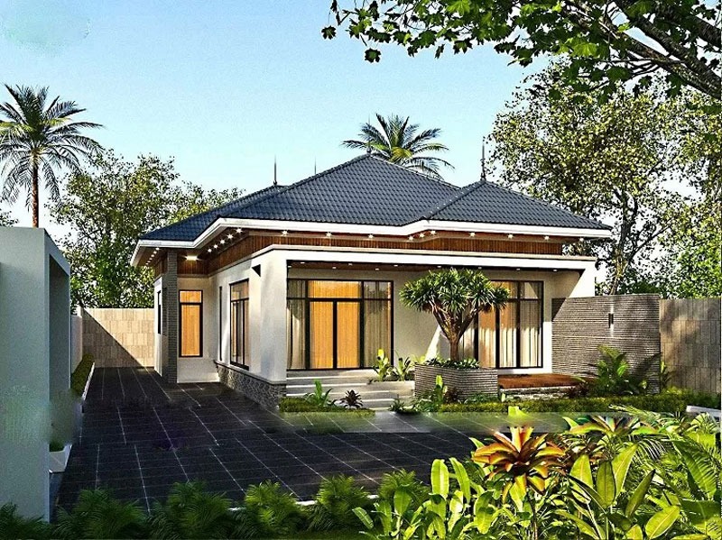 Nhà cấp 4 hiện đại với mái ngói xanh, vườn cây xanh bao quanh, thiết kế tinh tế dưới ánh nắng trời rực rỡ.