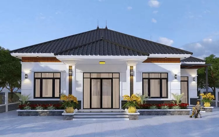 Nhà cấp 4 mái Thái hiện đại, sân rộng, cửa kính, cây xanh xung quanh, trời xanh nhiều mây.