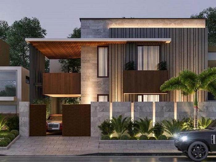 Ngôi nhà hiện đại với thiết kế ánh sáng buổi tối, cây cọ và ô tô đỗ phía trước, tạo cảm giác sang trọng.