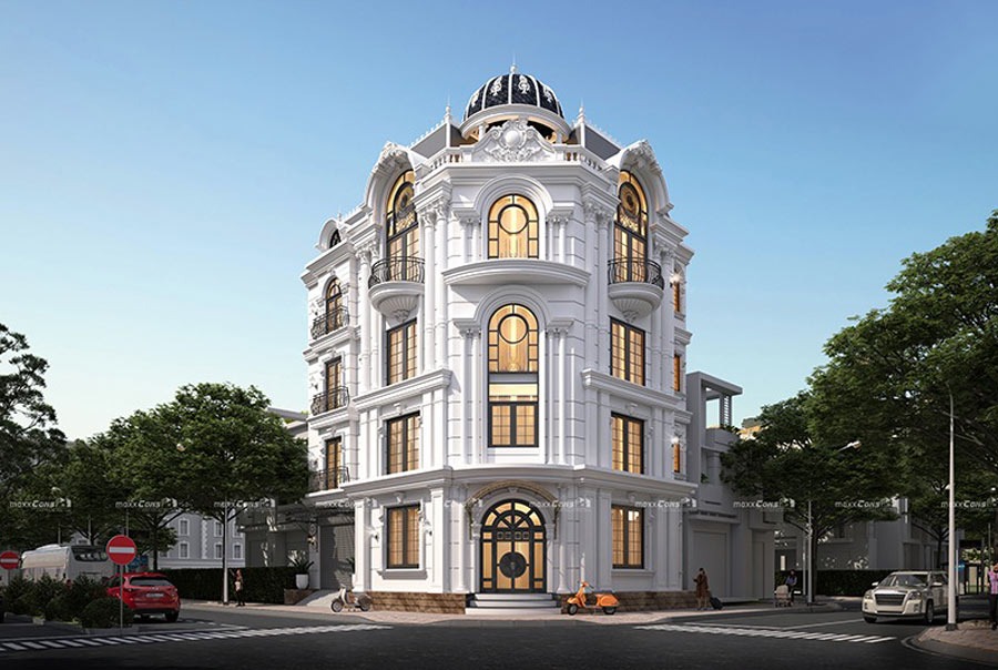 Tòa nhà kiến trúc cổ điển tại ngã tư, nổi bật với màu trắng và cửa sổ hình vòm, khung cảnh sáng sủa.