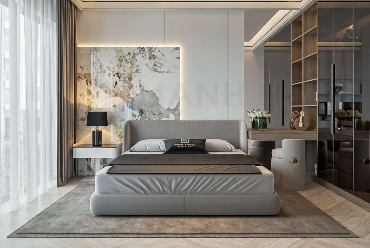 Phòng ngủ hiện đại với giường rộng, đèn bàn, và trang trí tường sang trọng.