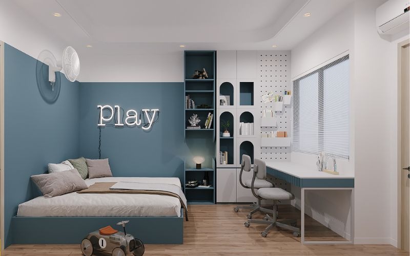 Phòng ngủ hiện đại với tông màu xanh, giường gọn gàng, bàn học dài và chữ Play treo tường.
