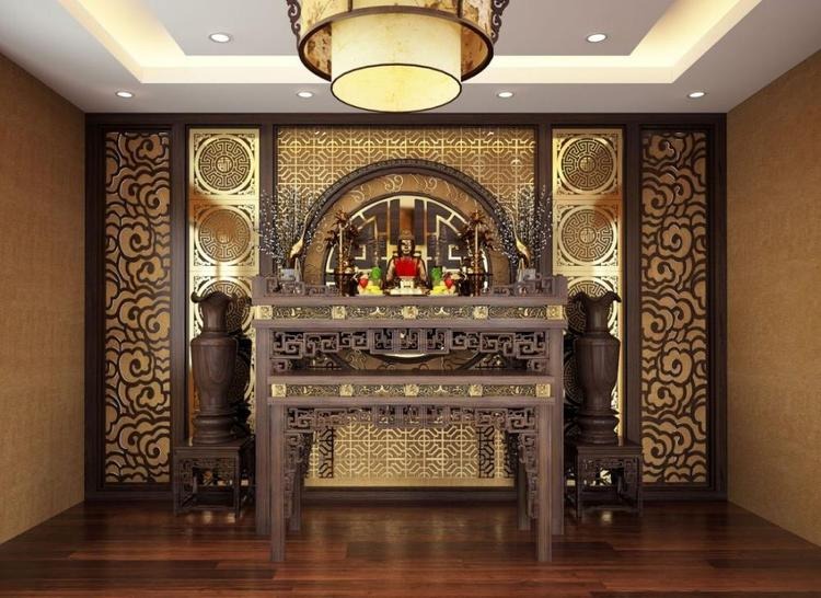 Phòng thờ trang trí với bàn thờ gỗ chạm khắc tinh xảo, nền trang trí họa tiết cổ điển, đèn trần sang trọng.