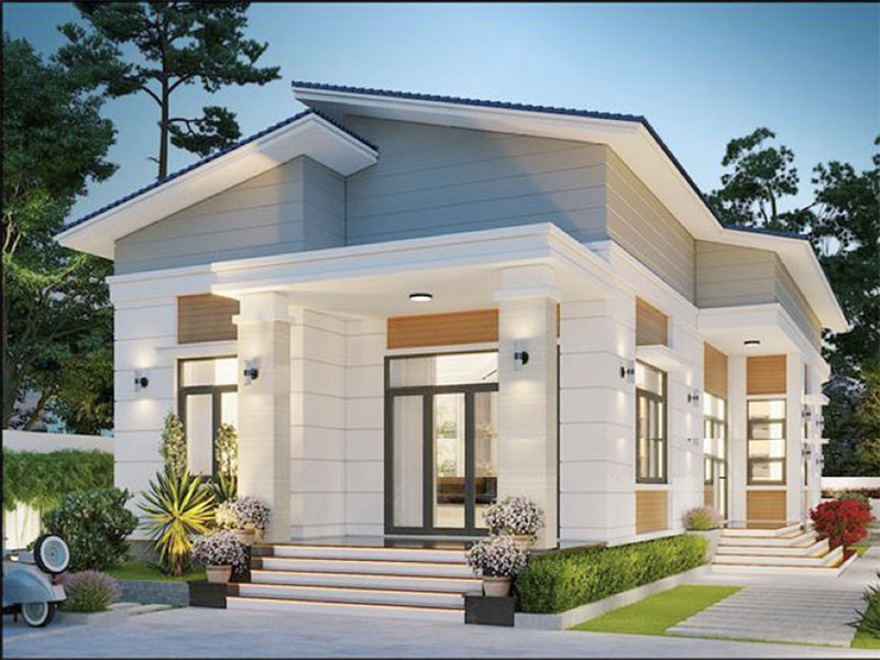 Nhà cấp 4 hiện đại với mái lệch, trang trí ánh đèn ngoại thất và cây xanh tạo không gian sống thoải mái.
