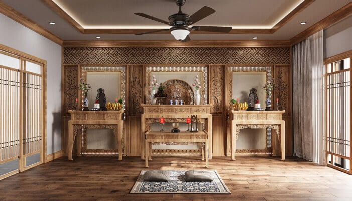 Phòng thờ gỗ truyền thống với bàn thờ chạm khắc, đệm ngồi và trang trí nội thất tạo không gian ấm cúng.